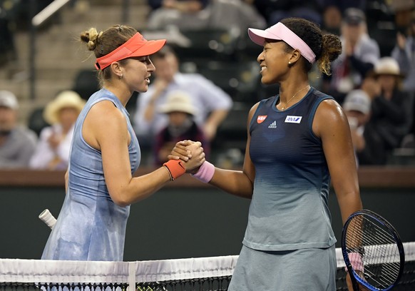Belinda Bencic, of Switzerland, left, shakes hands with Naomi Osaka, of Japan at the BNP Paribas Open tennis tournament Tuesday, March 12, 2019 in Indian Wells, Calif. (AP Photo/Mark J. Terrill)