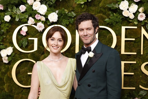 epa11809284 US actors Adam Brody (R) and his spouse Leighton Meester (L) arrive for the 82nd annual Golden Globe Awards ceremony at the Beverly Hilton Hotel in Beverly Hills, California, USA, 05 Janua ...