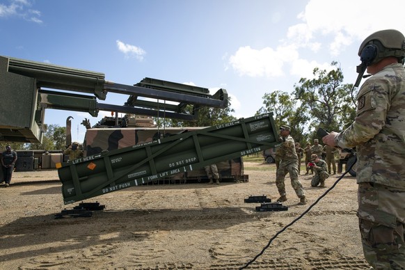 In this image provided by the U.S. Army U.S. Army Staff Sgt. Jimmy Lerma, crew chief for Alpha Battery, 1st Battalion, 3rd Field Artillery Regiment, 17th Field Artillery Brigade, adjusts the Army Tact ...
