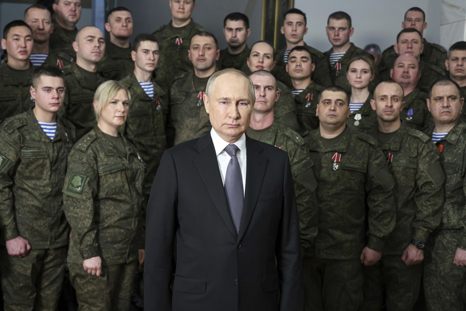 President Vladimir Putin speaks in his annual televised New Year&#039;s message after a ceremony during a visit to the headquarters of the Southern Military District, at an unknown location in Russia, ...