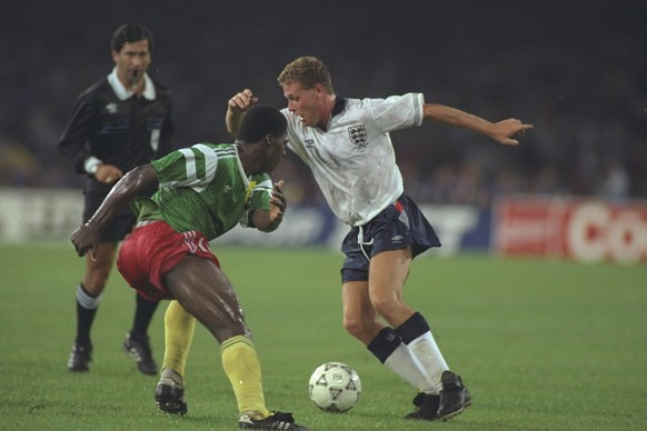 1 Jul 1990: Paul Gascoigne (right) of England uses his skills to get past the Cameroon player (left) during the World Cup Quarter Final match in Naples, Italy. England won the match 3-2. \ Mandatory C ...