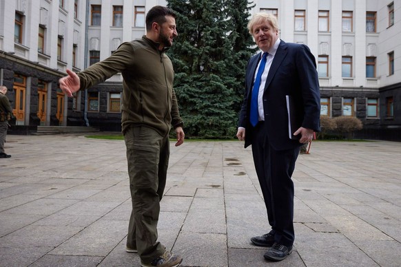 epa09880485 A handout photo made available via the official Telegram channel of the President of Ukraine shows Ukrainian President Volodymyr Zelensky (L) welcomes British Prime Minister Boris Johnson  ...