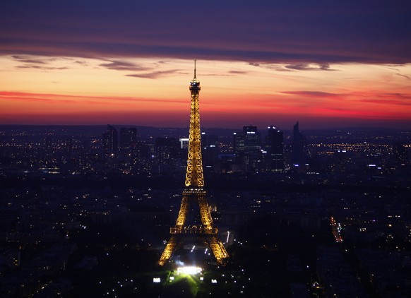 The illuminated Eiffel Tower is seen in Paris, Thursday July 14, 2011 at sunset. (AP Photo/Thibault Camus)