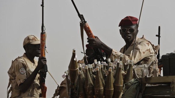 FILE - Sudanese soldiers from the Rapid Support Forces unit, led by Gen. Mohammed Hamdan Dagalo, the deputy head of the military council, secure the area where Dagalo attends a military-backed tribe&# ...