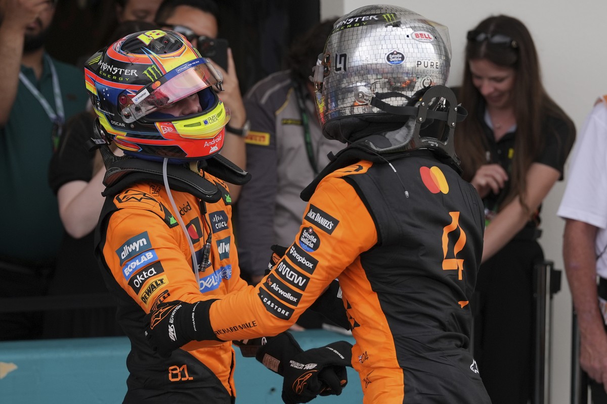 McLaren drivers Oscar Piastri of Australia, left, and Lando Norris of Britain celebrate after a first and second place finish in the Formula One Miami Grand Prix auto race Sunday, May 4, 2025, in Miam ...