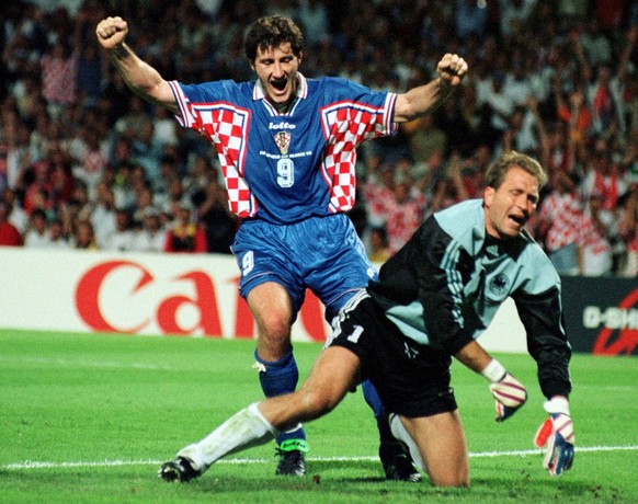 Croatia&#039;s Davor Suker celebrates over the distraught German goalkeeper Andreas Kopke after Goran Vlaovic scored the team&#039;s second goal during the Germany vs Croatia quarterfinal match at the ...