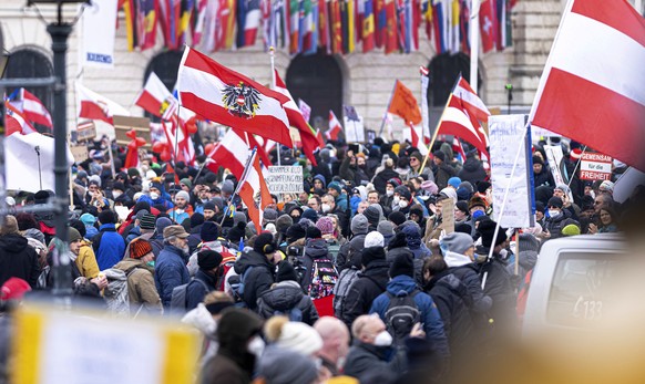 People take part in a demonstration against the country&#039;s coronavirus restrictions in Vienna, Austria, Saturday, Dec. 11, 2021. Thousands of protesters are expected to gather in Vienna after the  ...