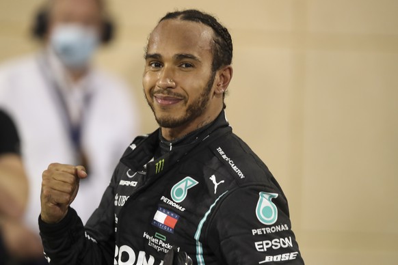 epa08851492 British Formula One driver Lewis Hamilton of Mercedes-AMG Petronas celebrates after winning the 2020 Formula One Grand Prix of Bahrain at Bahrain International Circuit near Manama, Bahrain ...