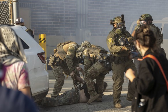 Immigration and Customs Enforcement officers arrest a protester at the ICE facility in Broadview, Ill., Friday, Sept. 19, 2025. (Zubaer Khan /Chicago Sun-Times via AP)
Trump Immigration Chicago