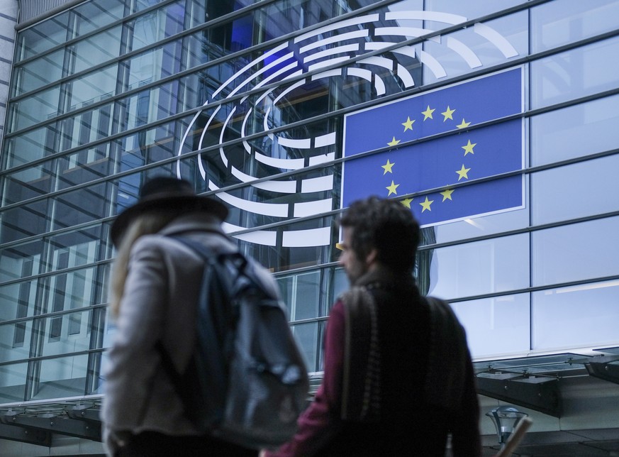 epa07586849 People walk past the European Parliament in Brussels, Belgium, 20 May 2019. The European Parliament election is to be held by member countries of the European Union (EU) from 23 to 26 May  ...