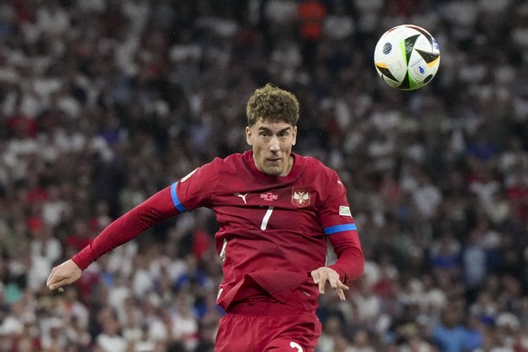 Serbia&#039;s Dusan Vlahovic heads the ball during a Group C match between Serbia and England at the Euro 2024 soccer tournament in Gelsenkirchen, Germany, Sunday, June 16, 2024. (AP Photo/Martin Meis ...