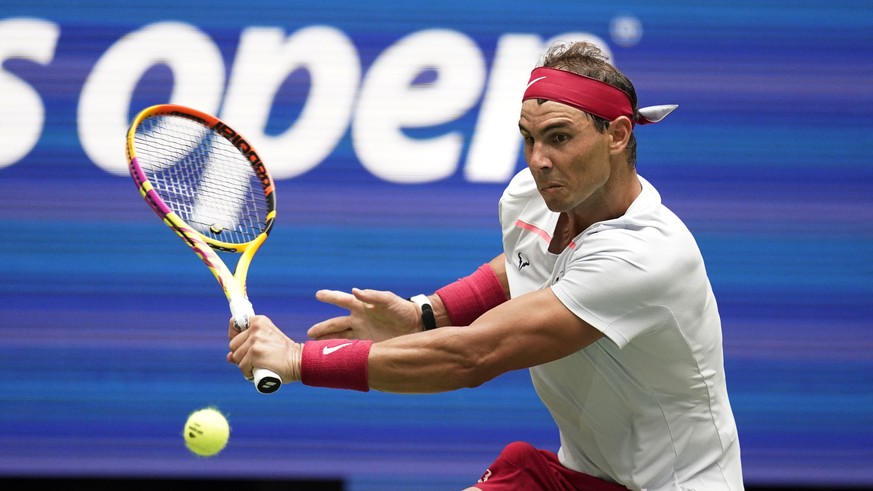 Rafael Nadal, of Spain, returns to Frances Tiafoe, of the United States, during the fourth round of the U.S. Open tennis championships, Monday, Sept. 5, 2022, in New York. (AP Photo/Julia Nikhinson)