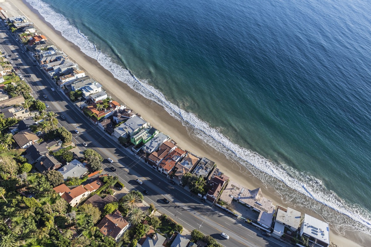 Aerial of beach homes along Pacific Coast Highway in Malibu California. xkwx aerial, architecture, bay, beach, beach house, california, coast, coastal, community, highway, highway 1, homes, houses, lo ...