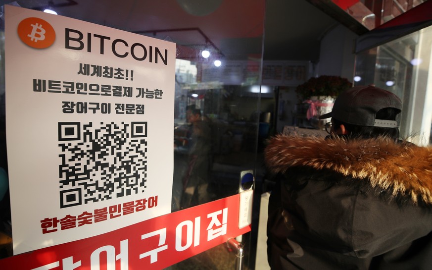 epa06396463 A restaurant shows a bitcoin sign as a payment option in Seoul, South Korea, 18 December 2017. The number of shops accepting cryptocurrencies has been on a gradual increase in the nation a ...