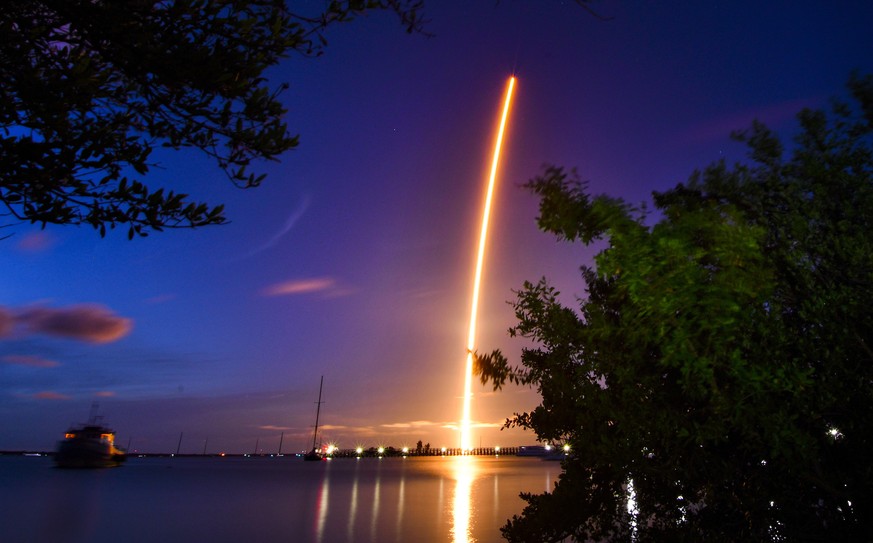 The launch of a SpaceX Crew Dragon capsule atop a Falcon 9 rocket is seen after taking off from Pad 39A at Kennedy Space Center in Cape Canaveral, Fla., late Wednesday, Sept. 15, 2021, with an all-ama ...