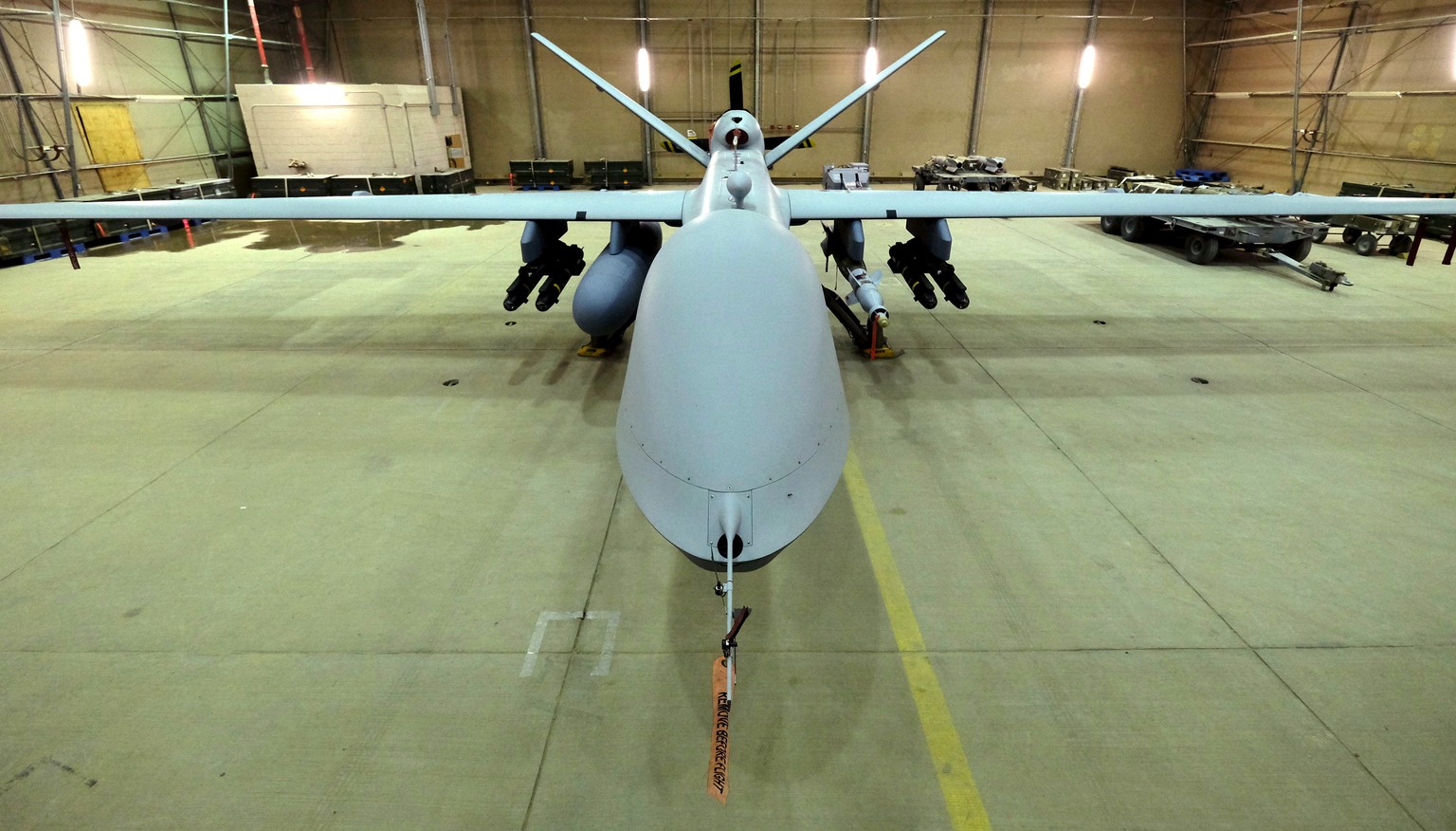 A U.S. Air Force MQ-9 Reaper drone sits armed with Hellfire missiles and a 500-pound bomb in a hanger at Kandahar Airfield, Afghanistan March 9, 2016. REUTERS/Josh Smith/File Photo