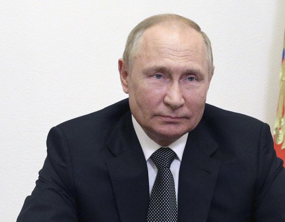 Russian President Vladimir Putin addresses participants of the Moscow Conference on International Security (MCIS) via a video link at the Novo-Ogaryovo state residence, outside Moscow, Russia, Tuesday ...