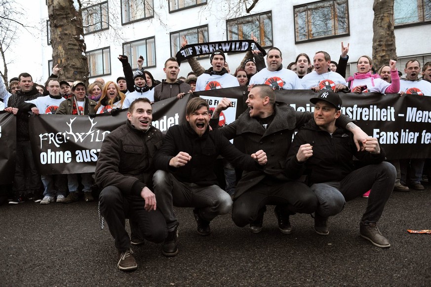 epa03634741 Jonas Notdurfter, Jochen Gargitter, Philipp Burger and Christian Fohrer (L-R) of the South Tyrol band Frei.Wild demonstrate with fans outside the Messe Berlin, Germany, 21 March 2013. Acco ...