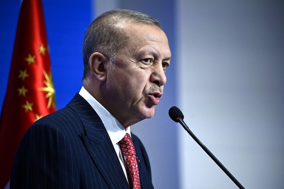 epa09556465 Turkish President Recep Tayyip Erdogan during a press conference at the G20 Summit in Rome, Italy, 31 October 2021. The Group of Twenty (G20) Heads of State and Government Summit was held  ...