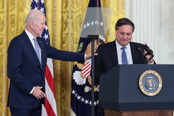 epa10443541 US President Joe Biden (L) introduces Ron Klain (R), Chief of Staff, during an official transition event to thank Klain and officially welcome Jeff Zients back to the White House as the ne ...