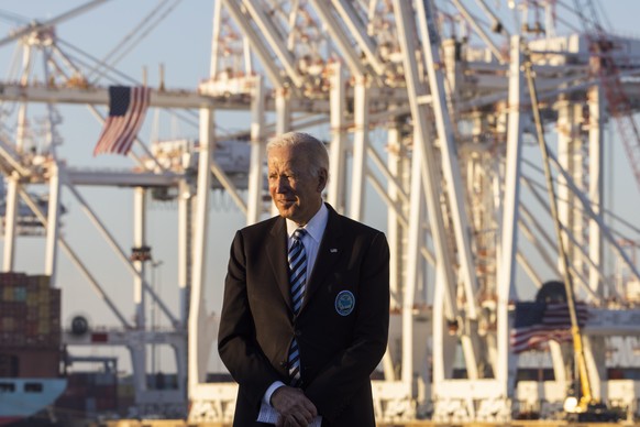 epa09574877 US President Joe Biden prepares to tout his recently-passed bipartisan infrastructure bill at the Port of Baltimore in Baltimore, Maryland, USA, 10 November 2021. Lawmakers will continue d ...