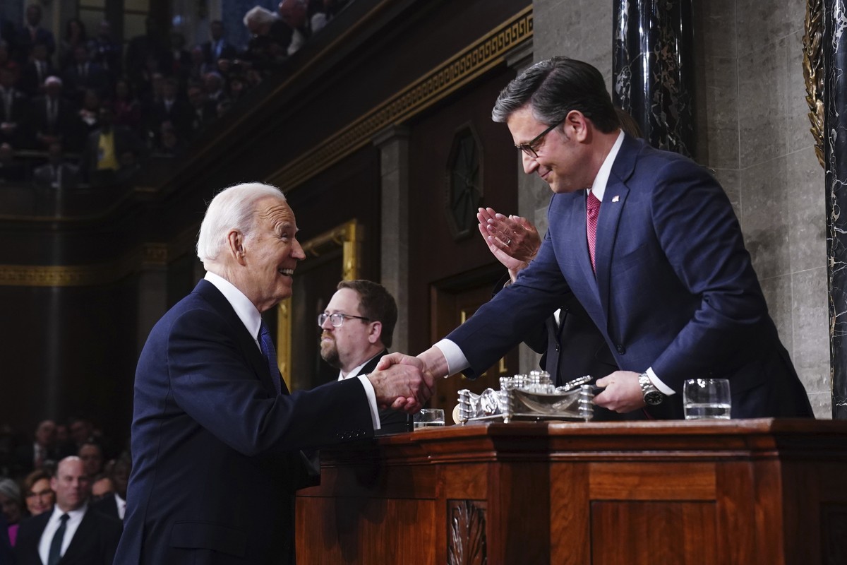 President Joe Biden, left, greets House Speaker Mike Johnson, R-La., before delivering the State of the Union address to a joint session of Congress at the Capitol, Thursday, March 7, 2024, in Washing ...