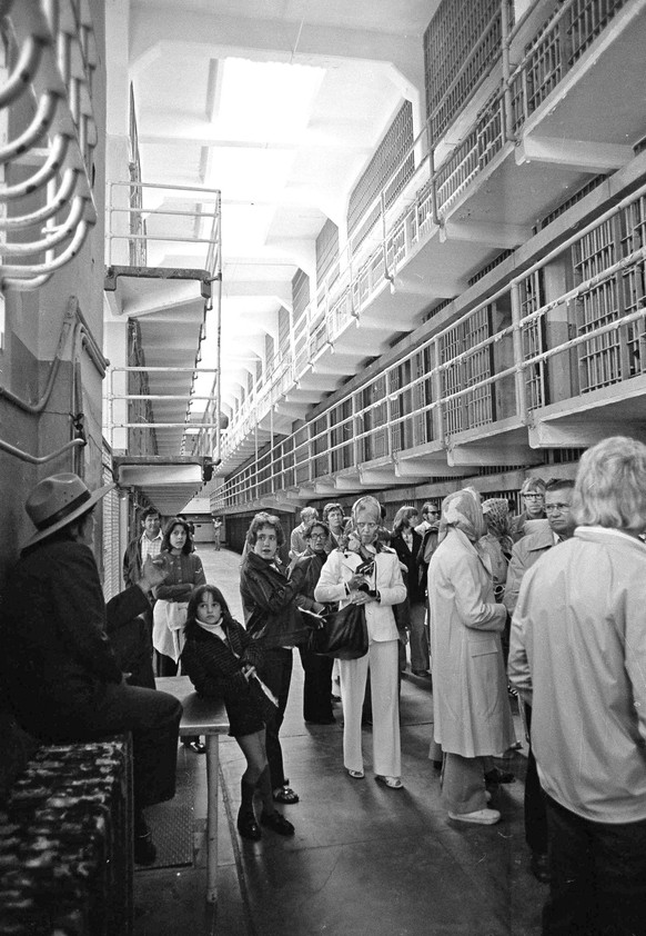 Kathy Gallagher, left, a guide for the National Park Service, briefs a group of visitors on the history of these cells at Alcatraz, the grim rock that for 29 years was the steel-barred home for 1,576  ...