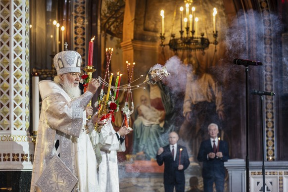 FILE - Russian Orthodox Church Patriarch Kirill, left, leads the Orthodox Easter service as Russian President Vladimir Putin, left, and Moscow Mayor Sergei Sobyanin stand near at Christ the Saviour Ca ...
