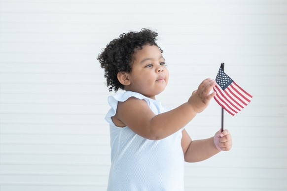 African American child with USA flag