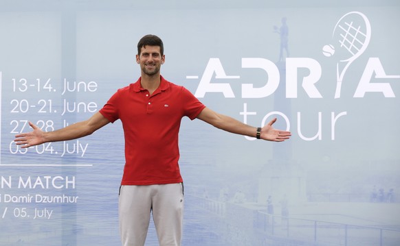 epa08443514 Serbian tennis player Novak Djokovic poses for photographers during a press conference on the upcoming Adria Tour tennis tournament in Belgrade, Serbia, 25 May 2020. Novak Djokovic present ...