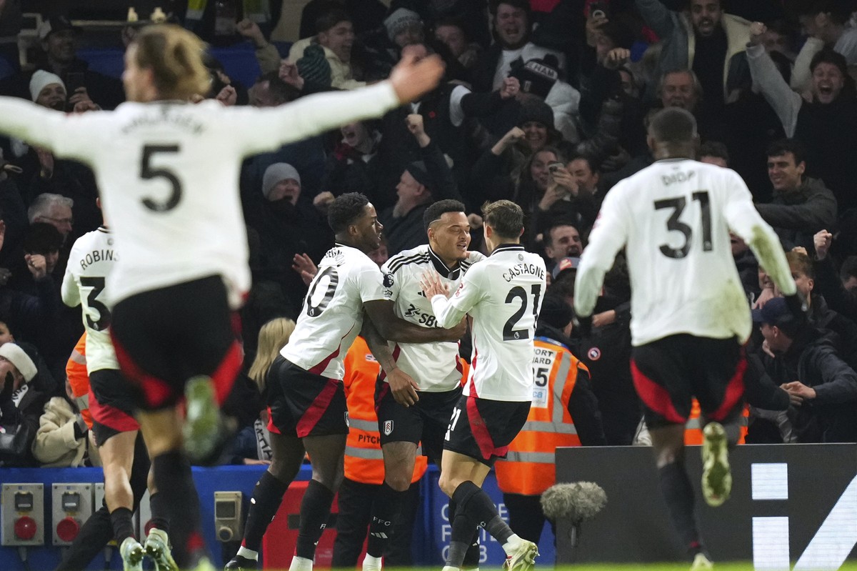 Fulham's Rodrigo Muniz, center, celebrates after scoring his sides second goal during the English Premier League soccer match between Chelsea and Fulham at Stamford Bridge stadium in London, Thur ...