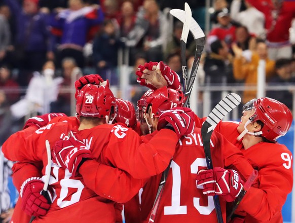 epa06563043 Players of Olympic Athletes of Russia celebrate after scoring the opening goal during the Men&#039;s Ice Hockey Gold Medal Game between the Olympic Athlete from Russia (OAR) and Germany at ...