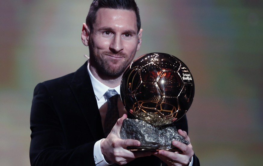 Barcelona&#039;s soccer player Lionel Messi holds the trophy of the Golden Ball award ceremony in Paris, Monday, Dec. 2, 2019. Messi won the Ballon d&#039;Or for sixth time. (AP Photo/Francois Mori)
L ...