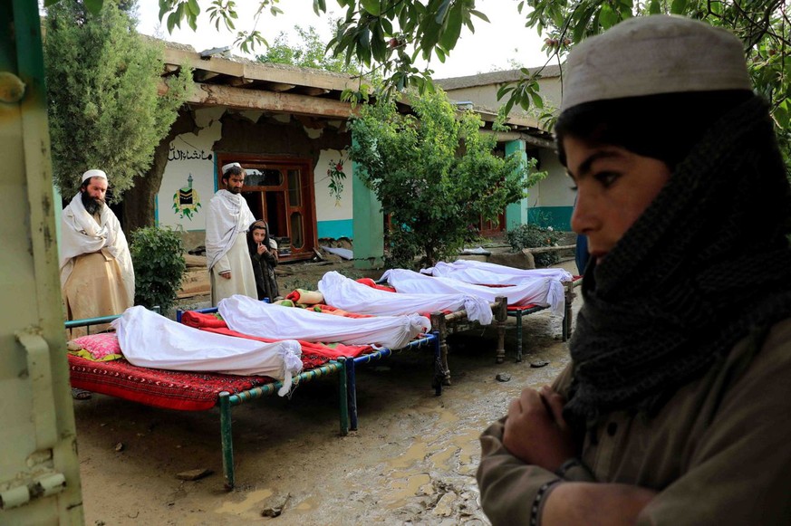 epa10028872 People attend funeral of the victims of earthquake in Gayan village in Paktia province, Afghanistan, 23 June 2022. More than 1,000 people were killed and over 1,500 others injured after a  ...