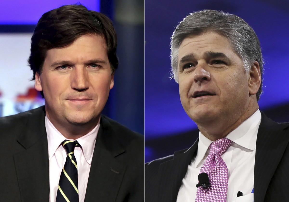 This combination photo shows, Tucker Carlson, host of "Tucker Carlson Tonight," left, and Sean Hannity, host of "Hannity" on Fox News. The Fox News and Fox Business channels are go ...