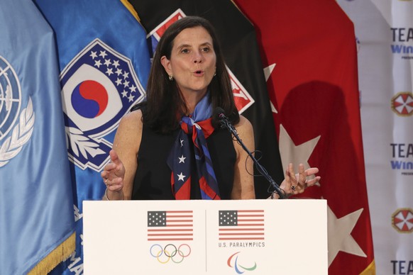 FILE - In this Aug. 1, 2017, file photo, then-U.S. Olympic Committee chief marketing officer Lisa Baird speaks about the Team USA WinterFest for the upcoming 2018 Pyeongchang Winter Olympic Games, at  ...