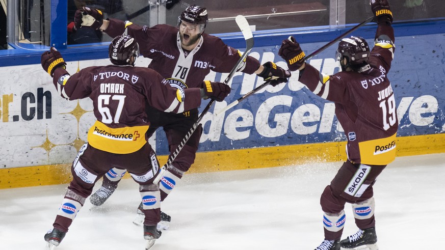 Geneve-Servette&#039;s Teemu Hartikainen, center, celebrates his goal to 4:1 with Linus Omark, left, and Josh Jooris, during the seventh and final leg of the ice hockey National League Swiss Champions ...