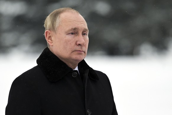 FILE - In this Jan. 27, 2022, photo, Russian President Vladimir Putin attends a wreath laying commemoration ceremony at the Piskaryovskoye Cemetery where most of the Leningrad Siege victims were burie ...
