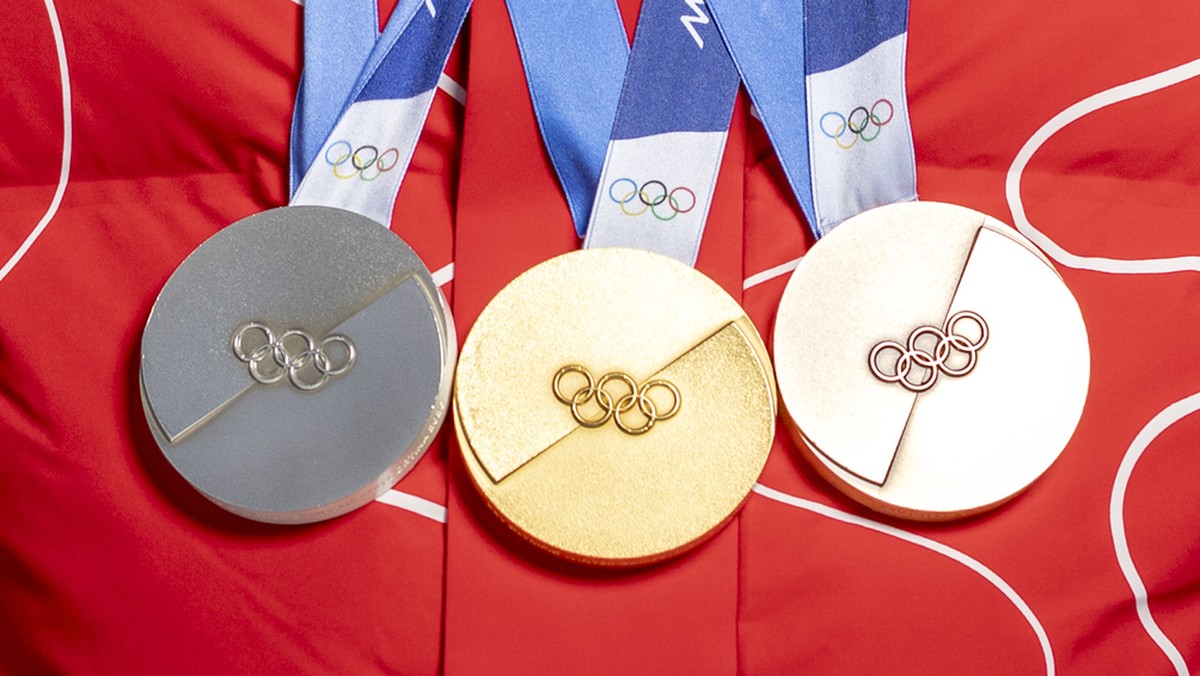 Gold medalist Switzerland's Loic Meillard poses with his medals after the men's alpine skiing slalom race at the 2026 Olympic Winter Games at the Stelvio Ski centre in Bormio, Italy, on Mond ...