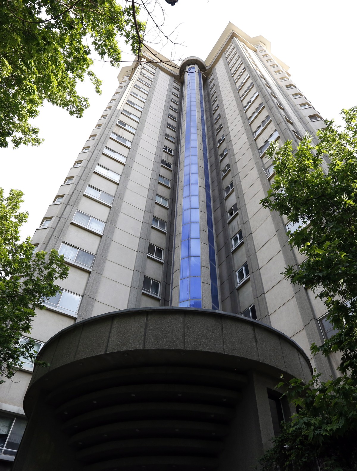 epa09177494 Exterior view of the high-riser where a Swiss embassy staff was resident, in the Kamranieh neighbourhood in Tehran, Iran, 04 May 2021. According to the emergency service spokesman, a senio ...