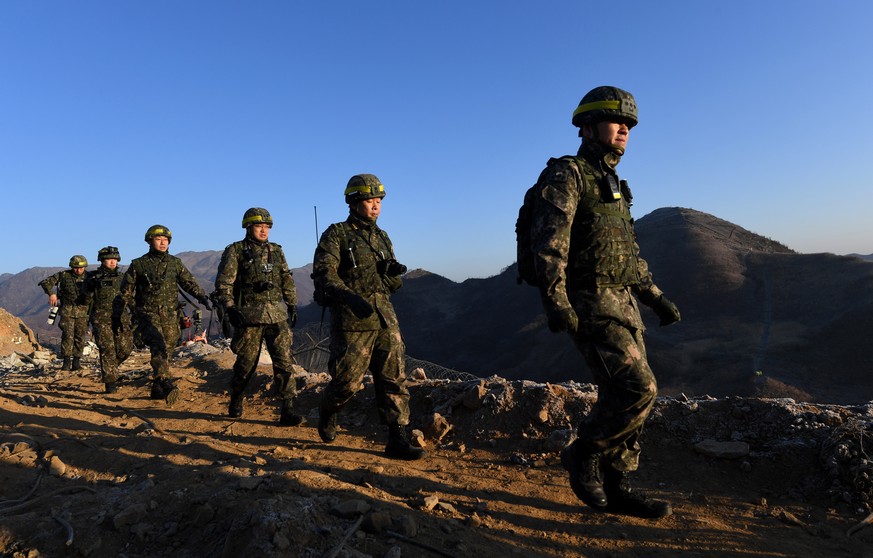 epa07224970 A South Korean inspection team heads to a North Korean guard post to begin a process to verify their recent work to withdraw most guard posts from the Demilitarized Zone (DMZ) through reci ...