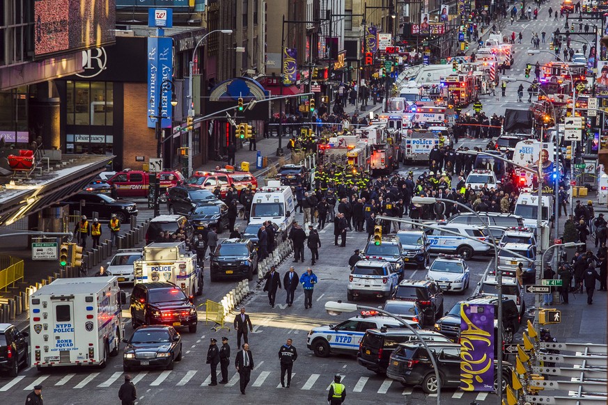 Law enforcement officials work following an explosion near New York&#039;s Times Square on Monday, Dec. 11, 2017, in New York. Police said a man with a pipe bomb strapped to him set off the crude devi ...