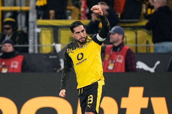 Dortmund's Emre Can celebrates after he scored his side's decisive third goal from the penalty spot during the German Bundesliga soccer match between Borussia Dortmund and St. Pauli in Dortm ...