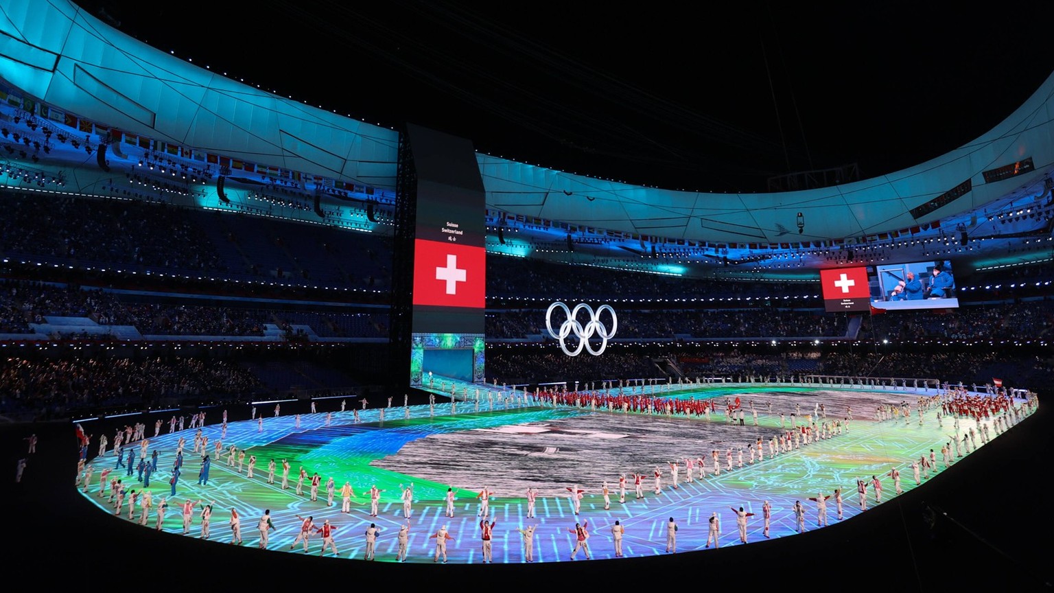 BEIJING, CHINA - FEBRUARY 04: Members of Team Switzerland enter the stadium during the Opening Ceremony of the Beijing 2022 Winter Olympics at the Beijing National Stadium on February 4, 2022 in Beiji ...