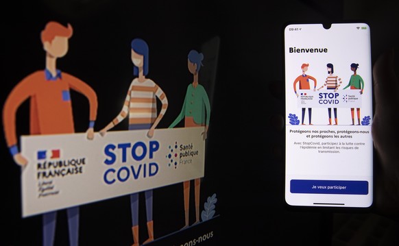 epa08444335 A photo illustration shows the French mobile phone application (app) StopCOVID, developped to trace peope who test positive for SARS-CoV-2 coronavirus causing the Covid-19 disease, in Pari ...
