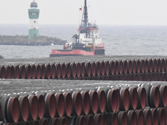 Pipes for the Nord Stream 2 Baltic Sea gas pipeline are stored on the premises of the port of Mukran near Sassnitz, Germany, on Dec. 4, 2020. Russia&#039;s natural gas pipeline to Europe is built and  ...
