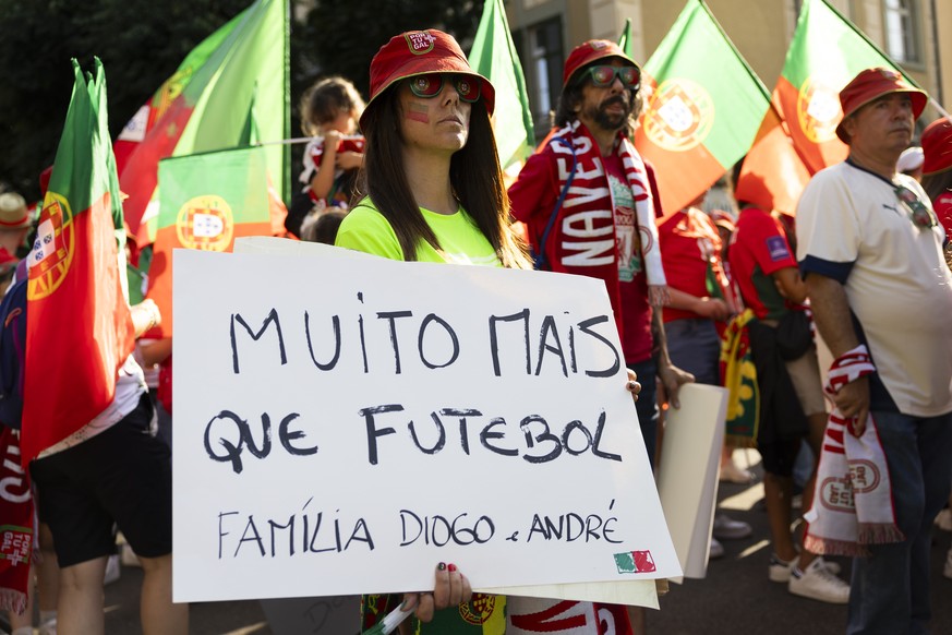 epa12213595 A Supporter holds a sign in memory of the late Portuguese soccer player Diogo Jota, who lost his life in a car crash in Spain on 03 July, during a fan walk ahead of the UEFA Women&#039;s E ...