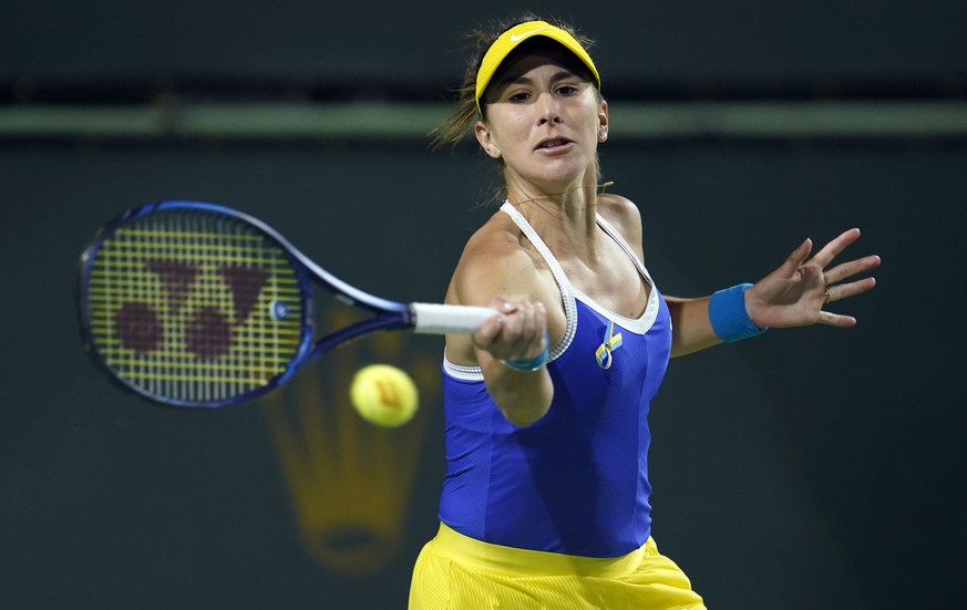 Belinda Bencic, of Switzerland, returns to Kaia Kanepi, of Estonia, at the BNP Paribas Open tennis tournament Friday, March 11, 2022, in Indian Wells, Calif. (AP Photo/Marcio Jose Sanchez)