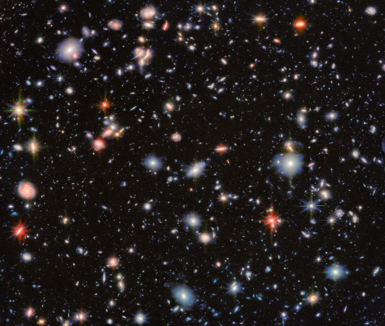 This image from the NASA/ESA/CSA James Webb Space Telescope revisits one of the most iconic regions of the sky, the Hubble Ultra Deep Field, through the eyes of two of Webb’s instruments. The result i ...