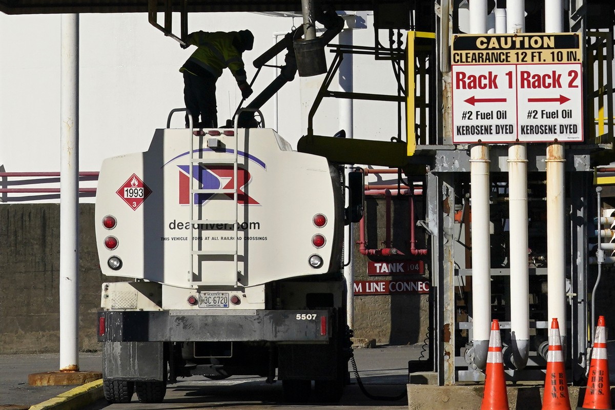 A driver for the Dead River oil company fills his truck with heating oil at the Sprague terminal, Tuesday, Dec. 13, 2022, in South Portland, Maine. Gov. Janet Mills and Maine's Senate Republicans ...